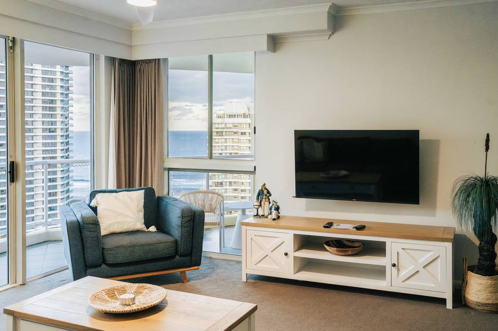 Lounge with ocean views through the balcony windows